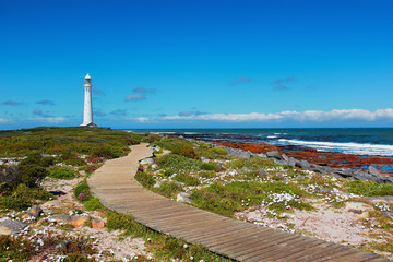 Kommetjie lighthouse in Cape town on clear blue day