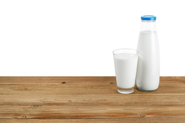 Bottle of milk and glass on white background