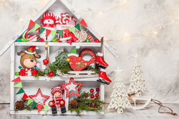 Christmas decoration with wooden house and toys