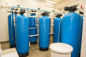 Water filters at the plant. Tanks and pipes. Renewed equipment works better. Modern technologies of water purification.