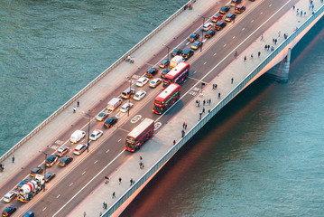 Traffic on a bridge of London. Night aerial view