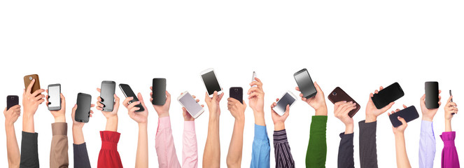 Fototapeta Many hands holding mobile phones isolated on white background obraz