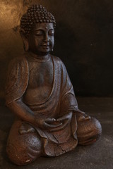 Buddha portrait isolated on a dark ground