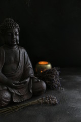 buddah witn candle spa concept