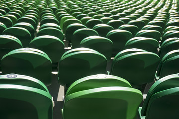 Naklejka premium Seating rows in a stadium with weathered chairs
