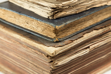 Vintage, old, antiquarian books pile close up.