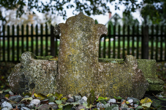 Carved granite cross on old abandoned Mennonites graveyard in Stogi Malborskie, Pomerania, Poland.