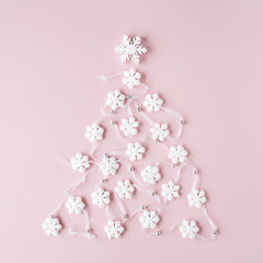 white christmas tree decoration on pink background. christmas wallpaper. flat lay, top view