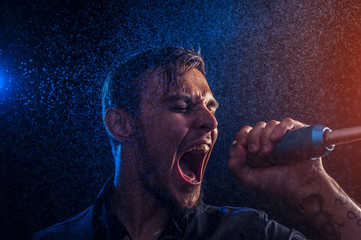 Expressive performer singing on microphone