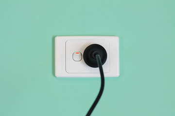 Australian electricity wall socket and plug illustrating expensive power, green energy and bill...