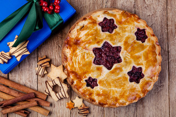 homemade cherry pie on a wooden table