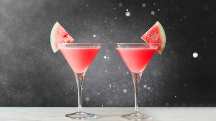 Watermelon Martini cocktail on bokeh background.