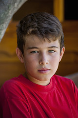 Portrait of a teenager in a garden