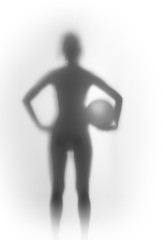 Sexy standing slim woman silhouette with ball