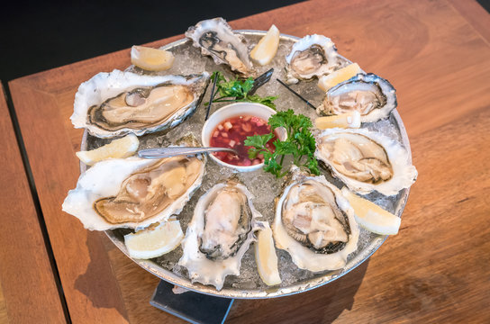 Fresh oysters on ice with lemon
