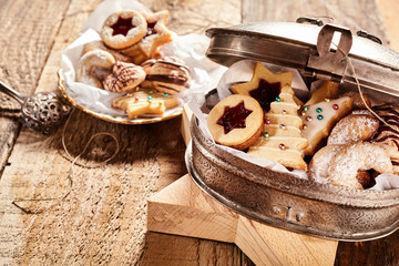 Half open cookie container over wood background