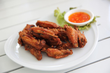 Fried chicken on wood background