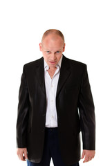 Adult male in a business suit with a drunken and angry face on the isolated background