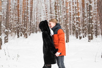 Fototapeta na wymiar Young couple kissing on winter day
