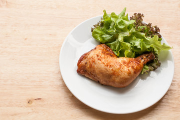 homemade grilled chicken and salad on wooden table