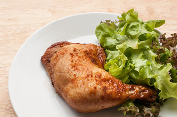 homemade grilled chicken and salad on wooden table
