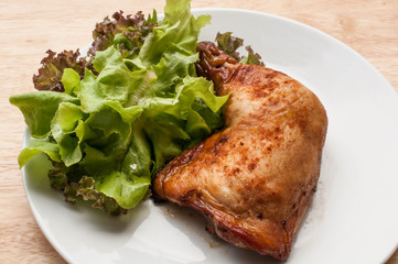 homemade grilled chicken and salad on wooden table