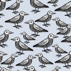 Doodle cute ravens vector seamless pattern.