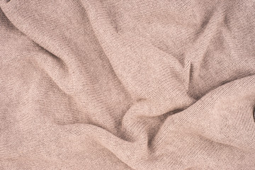 close up beige knitted pullover background.