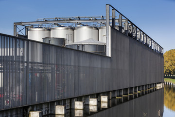 Industrial security fence and storage tanks