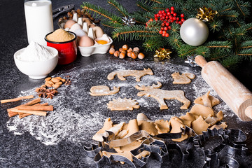 Baking ingredients for Christmas cookies gingerbread. Molds for baking, spices and  decorations for Christmas.