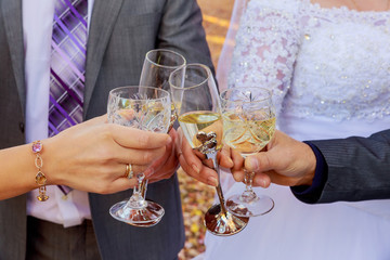 Bride and bridesmaids celebrate  drink champagne from glasses