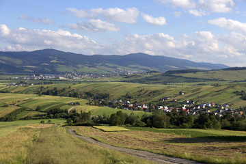 Fototapeta na wymiar Clear green Landscape with little Village from the summer Mountains Magura in Slovakia