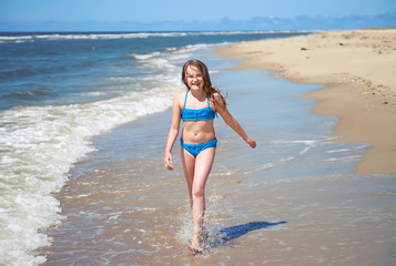 Fototapeta na wymiar young girl on a beach