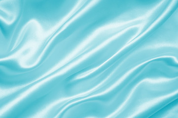 Smooth elegant blue silk or satin as background
