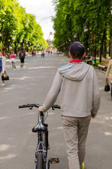 Naklejka premium Young man with bicycle