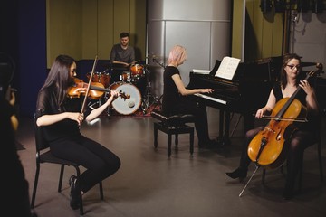 Group of students playing various instruments