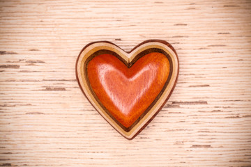 One wooden heart on rustic wood background. Valentines days conc