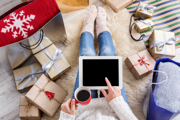 Woman shopping online with a credit card