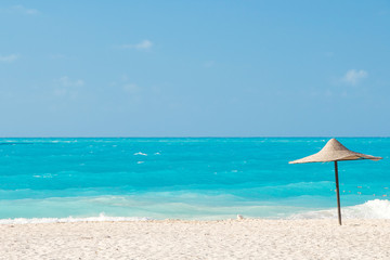 parasol on a tropical azure beach