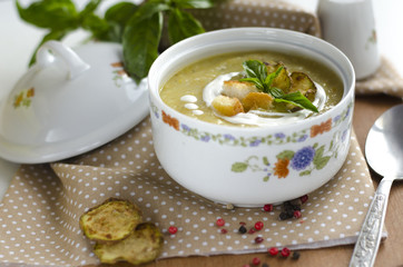 Cream soup with a basil and vegetable marrows  