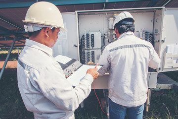 engineer or electrician working on  maintenance equipment at industry solar power