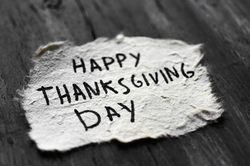 text happy thanksgiving day in a paper