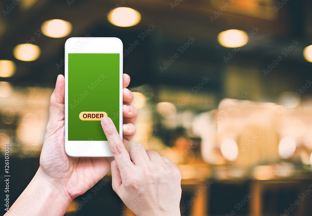 Fototapete hand holding mobile with order button and empty screen for addin