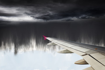 Fototapeta na wymiar Airplane is flying into the heavy rain.