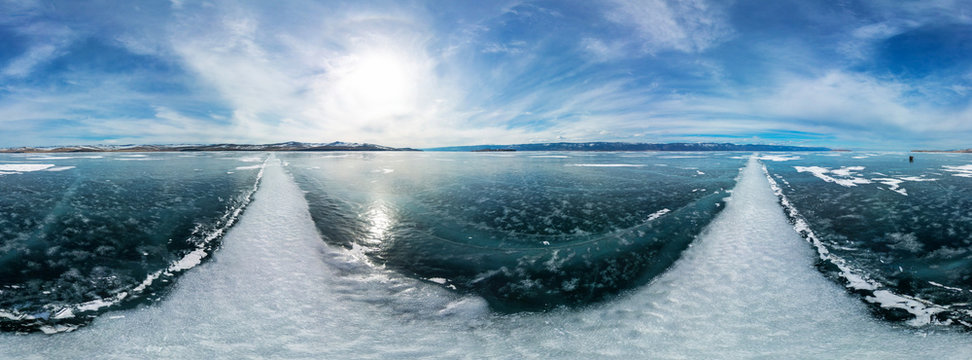 cylindrical panorama 360 a big white cracks on the ice of Lake B