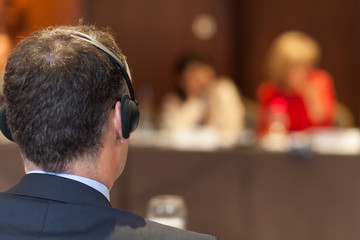 man with headset at the conference - obrazy, fototapety, plakaty