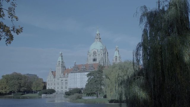 New Town Hall in Hanover, Germany. Zoom on back of the building in 4K and S-Log3. Long shot. Autumn. Neues Rathaus Hannover. 

