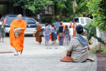 Local people wait monks for offer the food