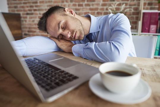 Man sleeping on the office desk