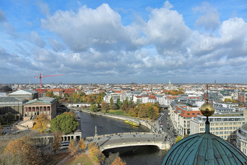 North view of Berlin from viewing gallery around the dome of Berlin Cathedral in autumn day, Germany. The foreground shows Friedrichs Bridge crossing the Spree between Museum Island and the mainland.